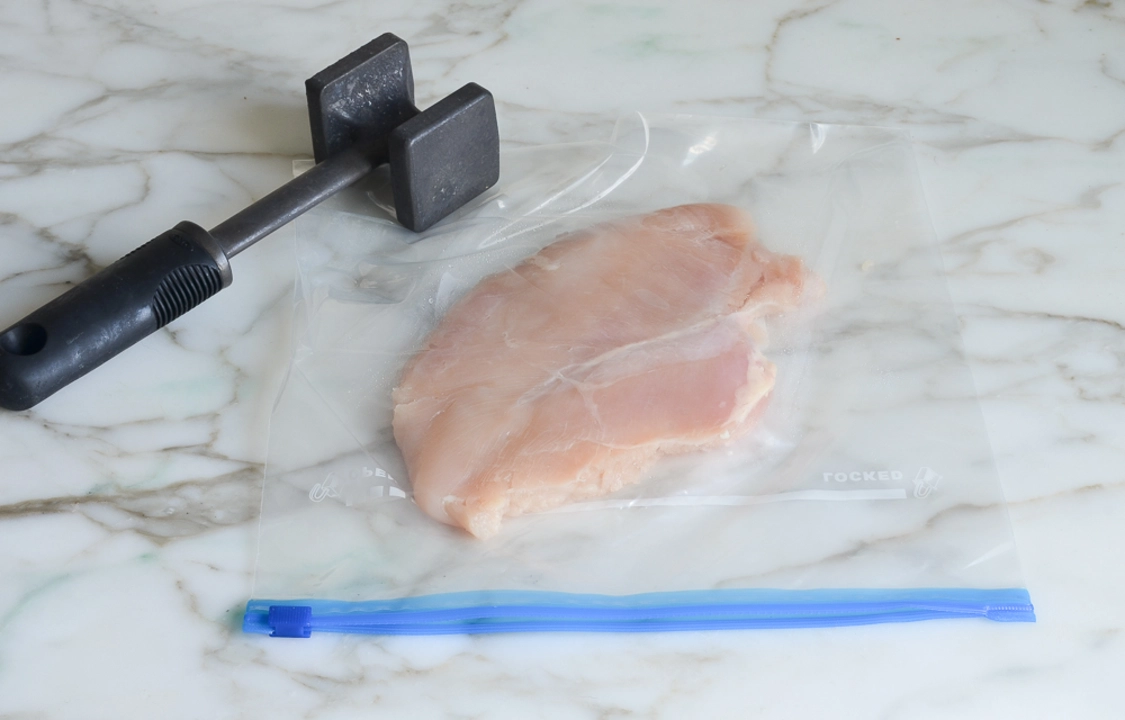 Why should you pound chicken breasts before cooking them?